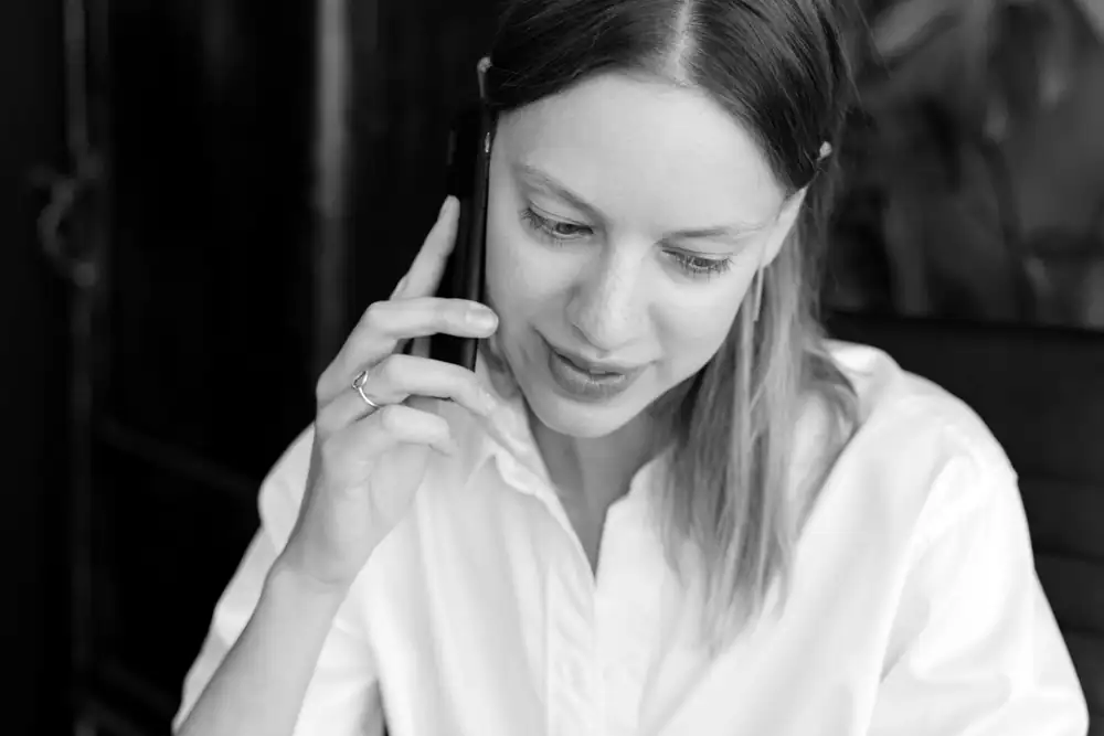 A saleswoman on the phone with a prospect