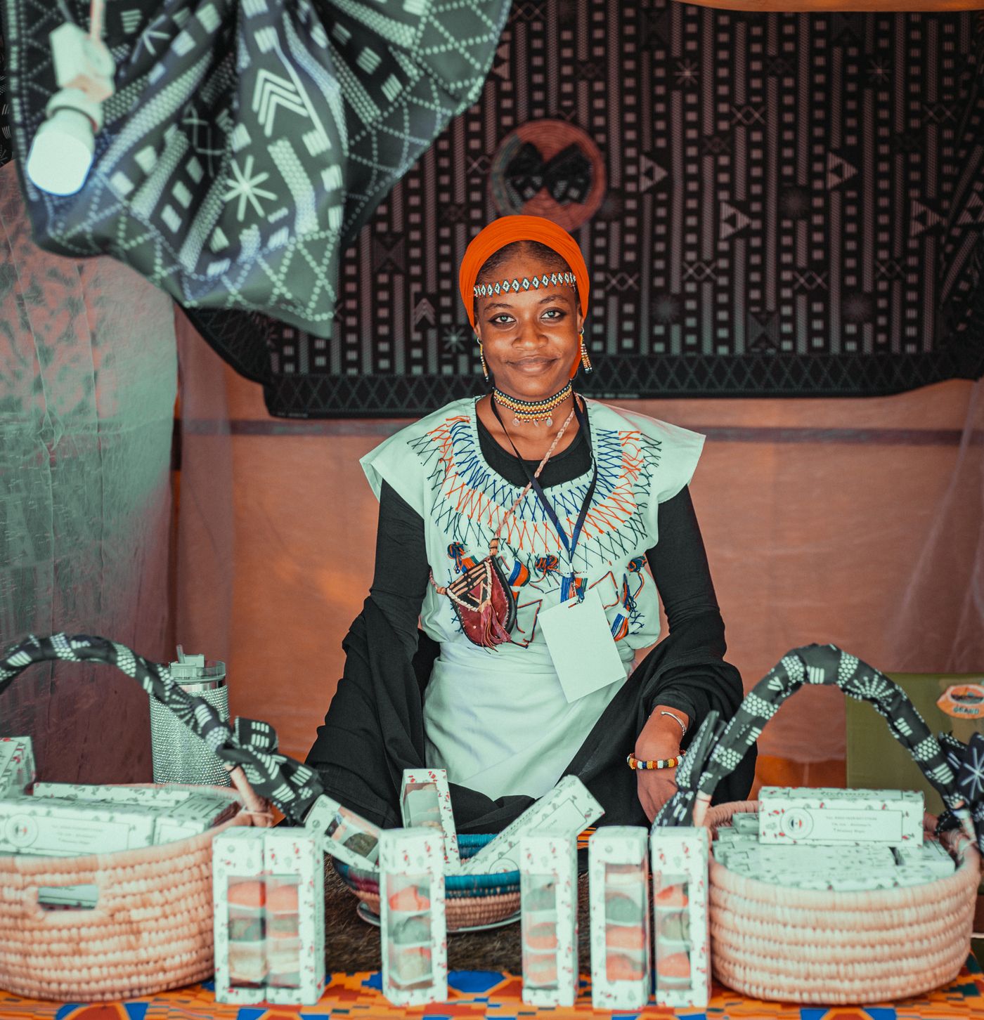 A shopkeeper at her counter